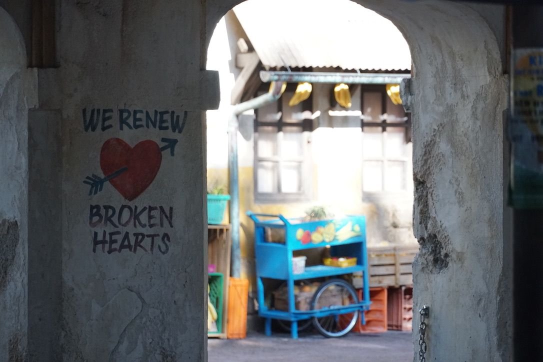 A wall painted with "we renew broken hearts" at Disney's Animal Kingdom