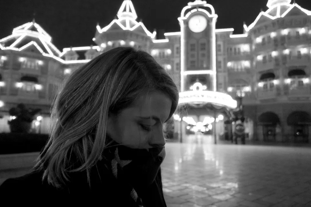 My wife pictured outside the Disneyland Hotel in Disneyland Paris