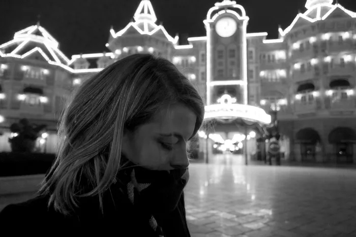 My wife pictured outside the Disneyland Hotel in Disneyland Paris